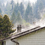 Photo of rain coming down on a roof